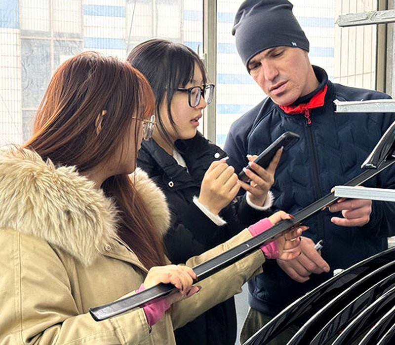 About 12 Yirox engineering team reviewing product samples before production