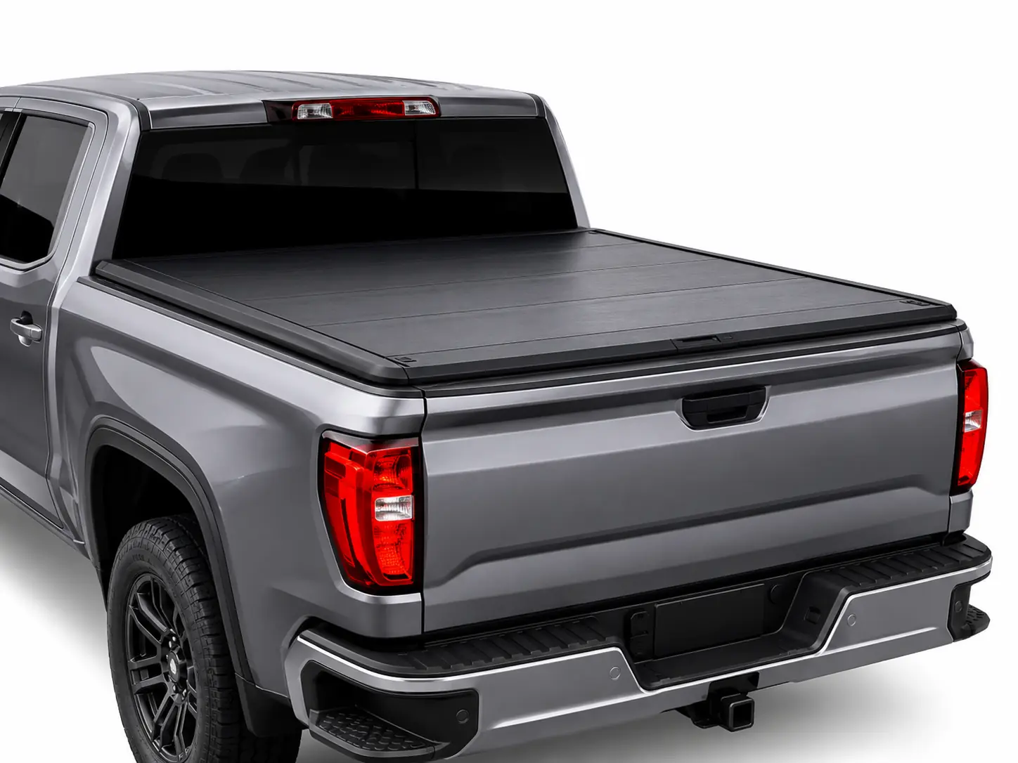 Pickup Tonneau Covers Hard folding pickup tonneau cover installed on a truck bed for cargo protection and pickup accessory customization