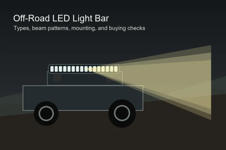 Off-road truck driving at night with an LED light bar mounted above the windshield and beams lighting the trail ahead