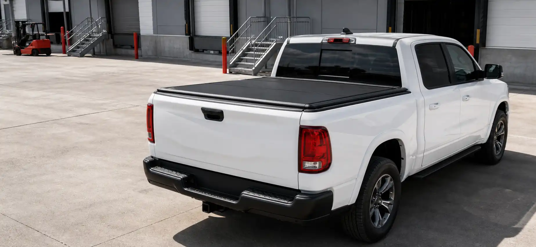 Pickup truck with black hard tonneau cover installed for B2B truck bed cover sourcing