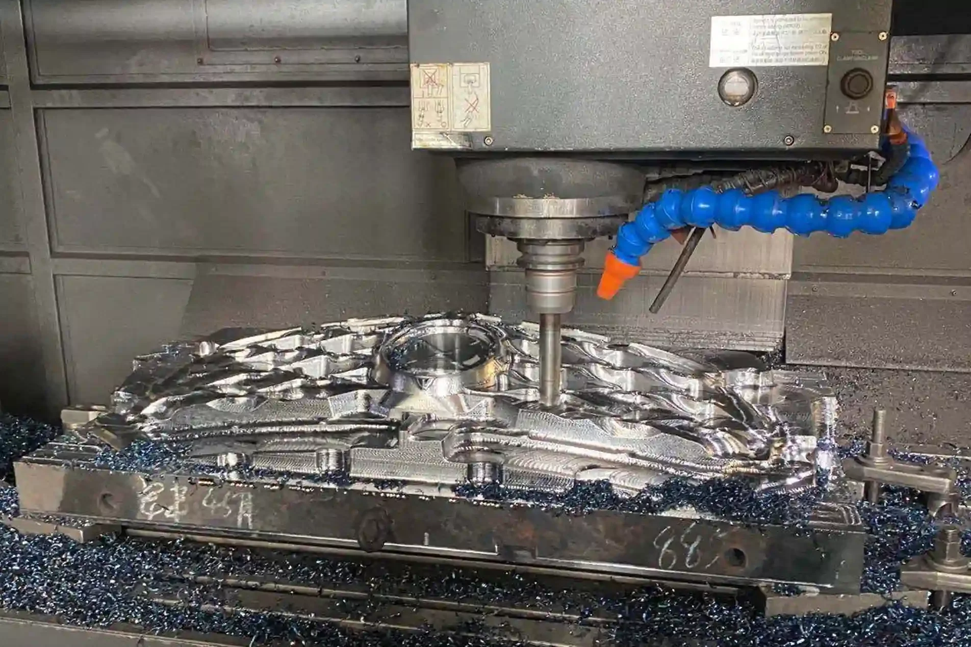 Automotive Plastic Injection Molding 13 CNC machining center milling a steel injection mold cavity