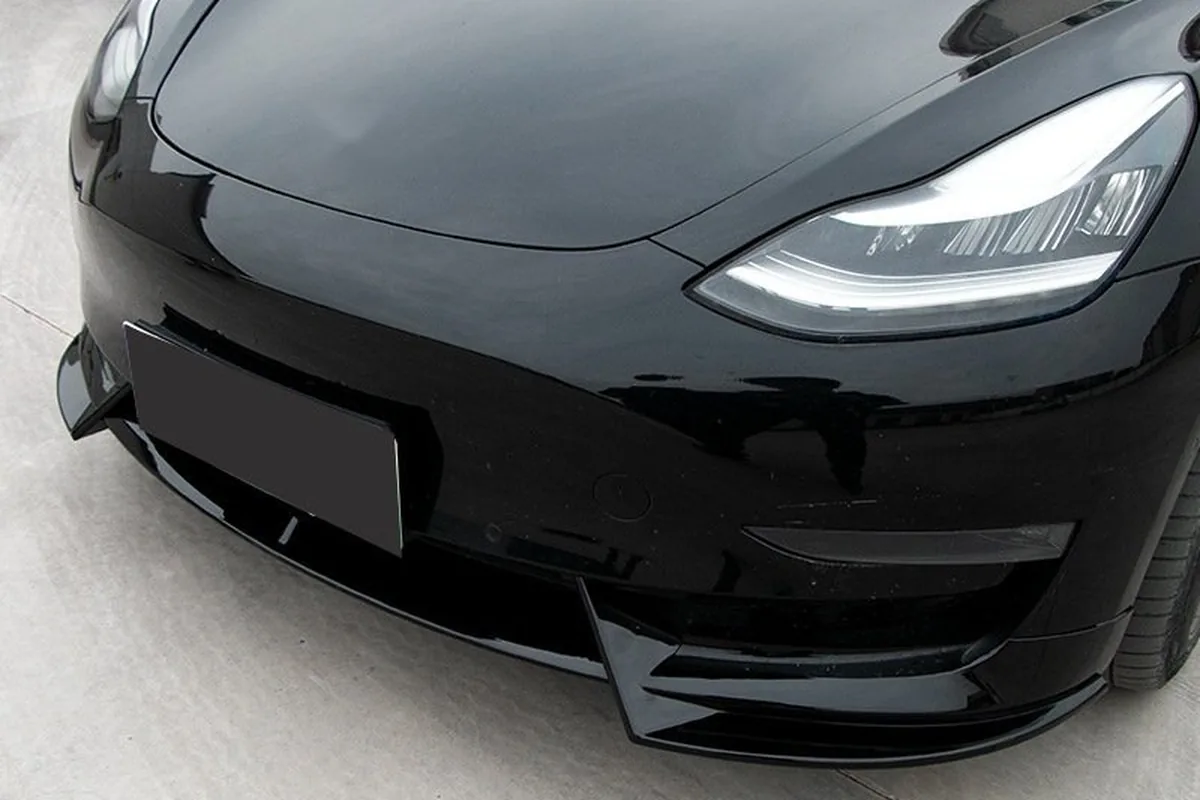 Tesla Model Y Accessories: What Distributors Should Stock and How to Check Fit 2 Gloss black front lip with corner canards fitted under the front bumper of a black Tesla