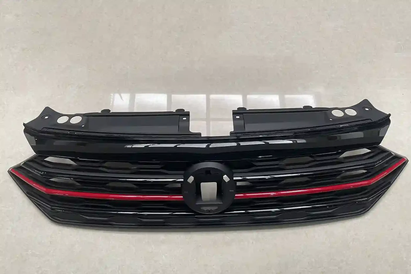 Manufacturing Capabilities 20 Gloss black front grille with a red trim line