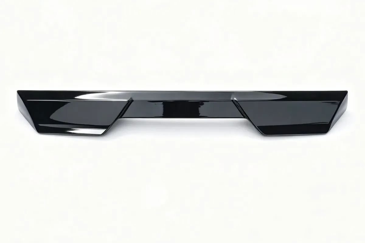 Carbon Fiber vs ABS vs Fiberglass Spoilers: Materials, Durability and Cost 2 Gloss black injection-molded plastic rear spoiler on a white background