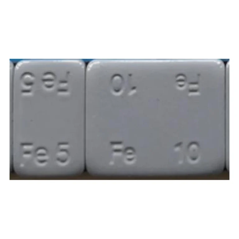 Close-up of rounded corner grey coated Fe5 and Fe10 steel wheel weight segments