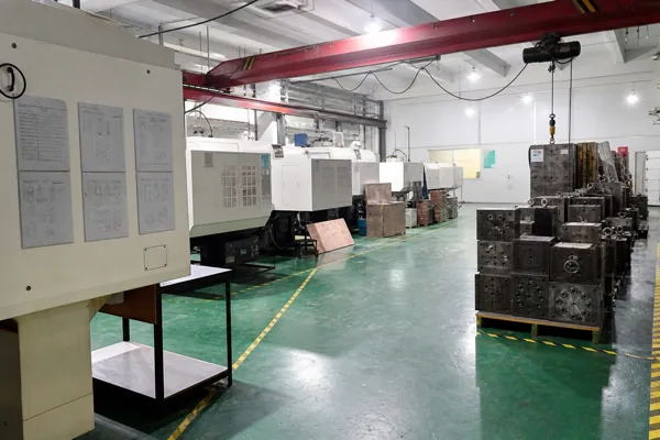 Injection molding machines and stacked mold tooling in the Wuxi factory mold workshop