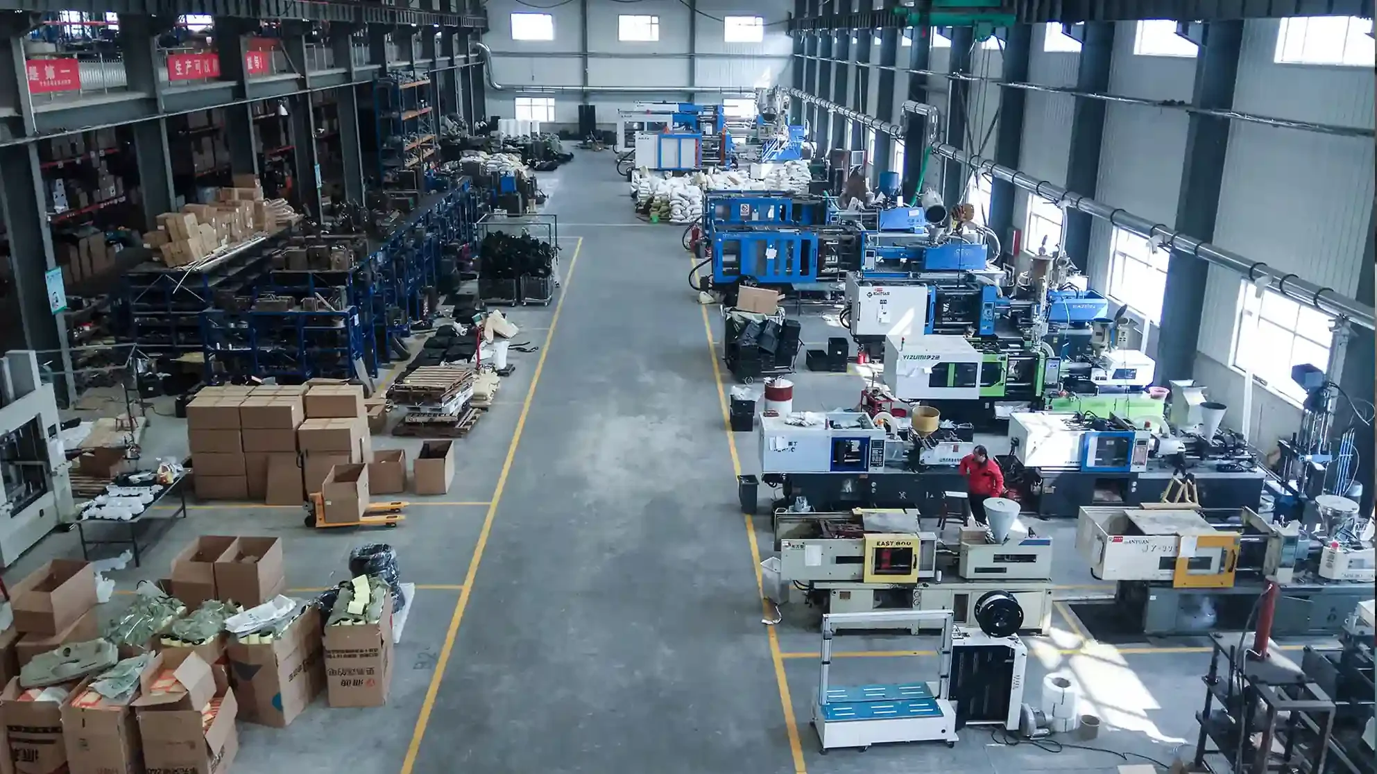 Automotive Plastic Injection Molding 11 Overhead view of the Yirox injection molding hall with molding machines and parts storage