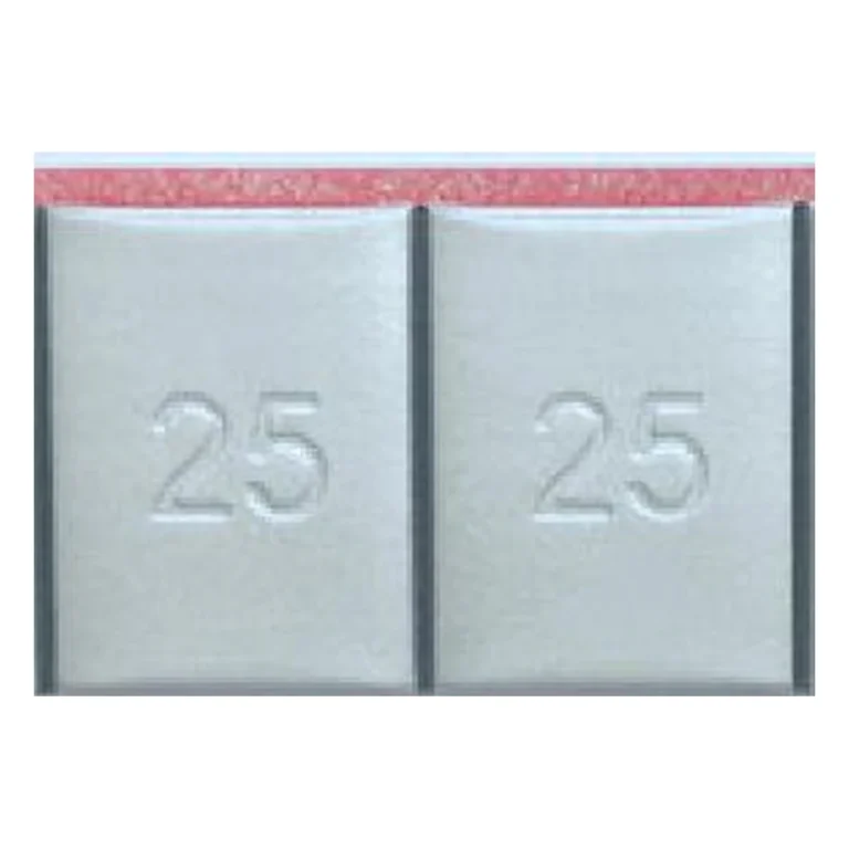Close-up of grey coated lead 25g adhesive wheel weight segments