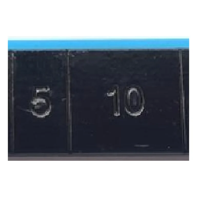 Close-up of black coated lead 5g and 10g adhesive wheel weight segments