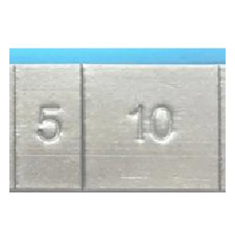 Close-up of grey coated lead 5g and 10g adhesive wheel weight segments