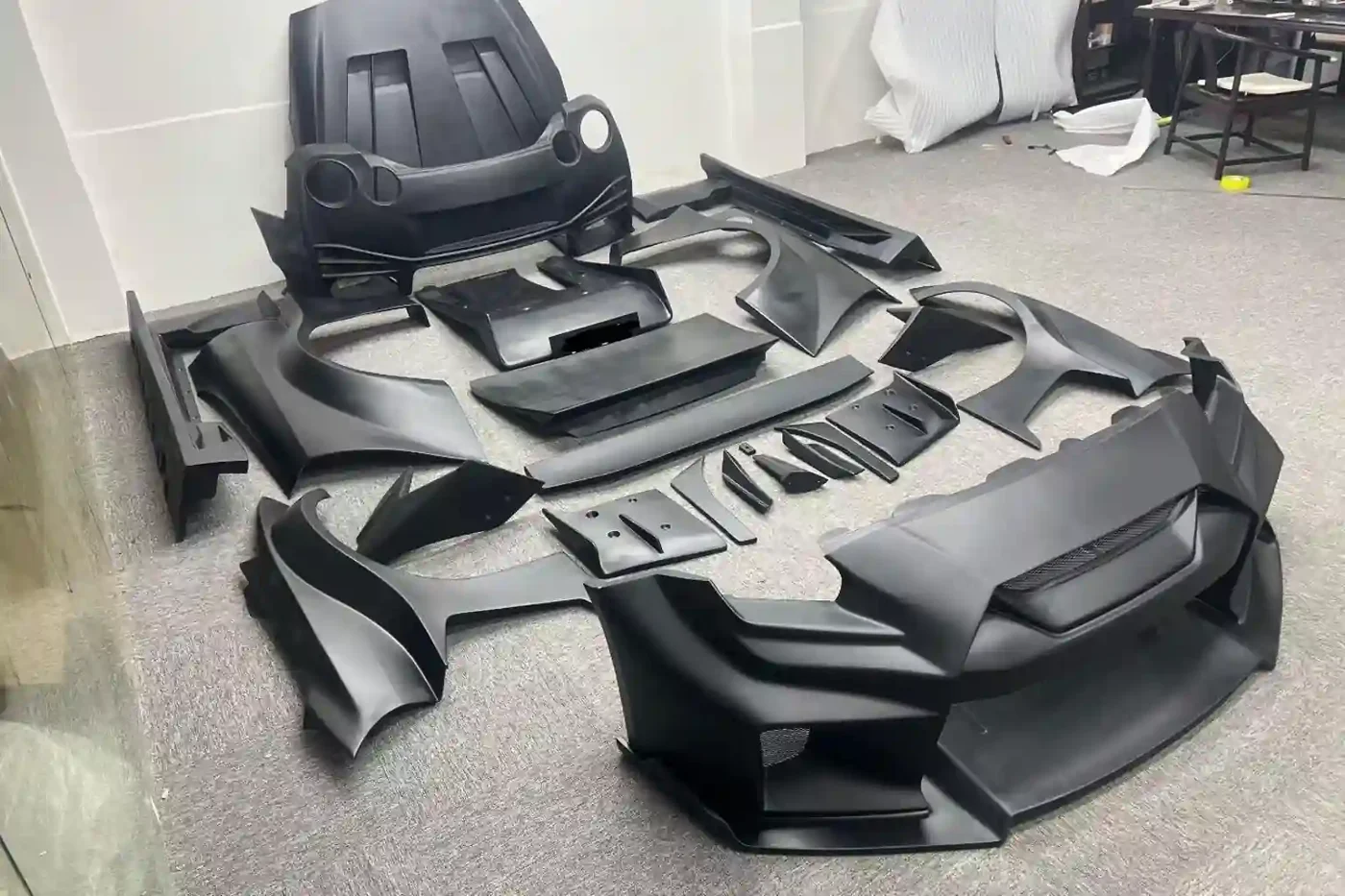Materials & Finishes 7 Partner-made composite body kit parts in matte black