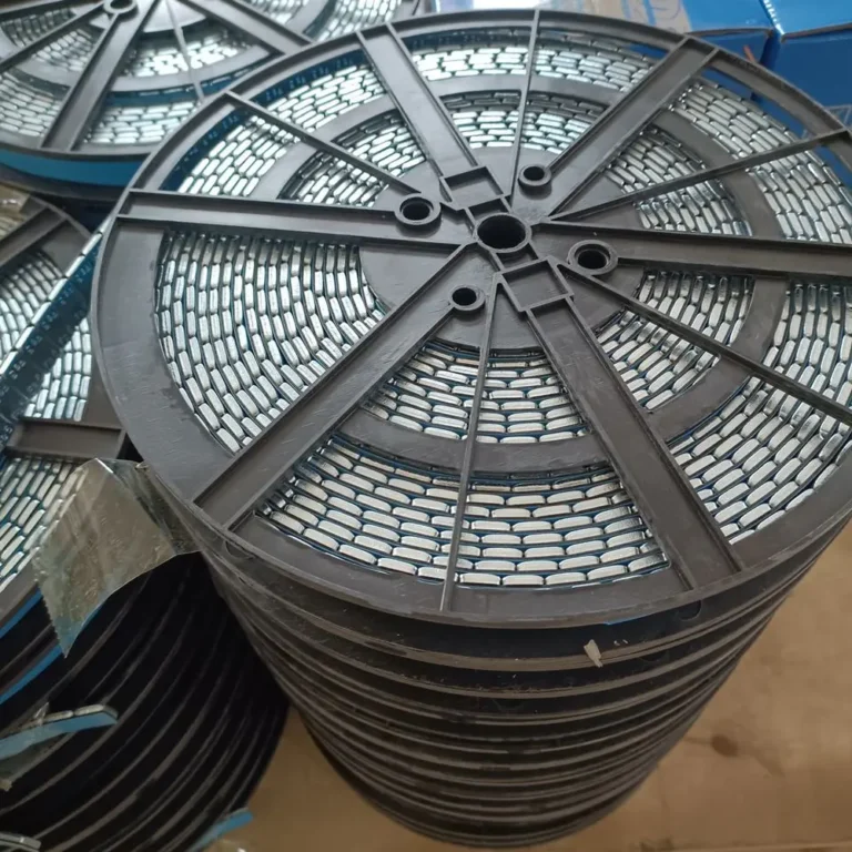 Stacked 5 kg steel adhesive wheel weight rolls on plastic reels