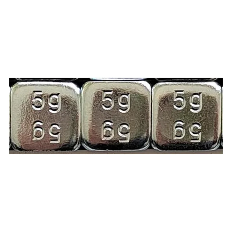 Close-up of zinc plated 4 mm rounded 5g steel adhesive wheel weight segments