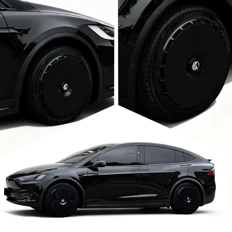 Black cyber wheel covers installed on a black Tesla