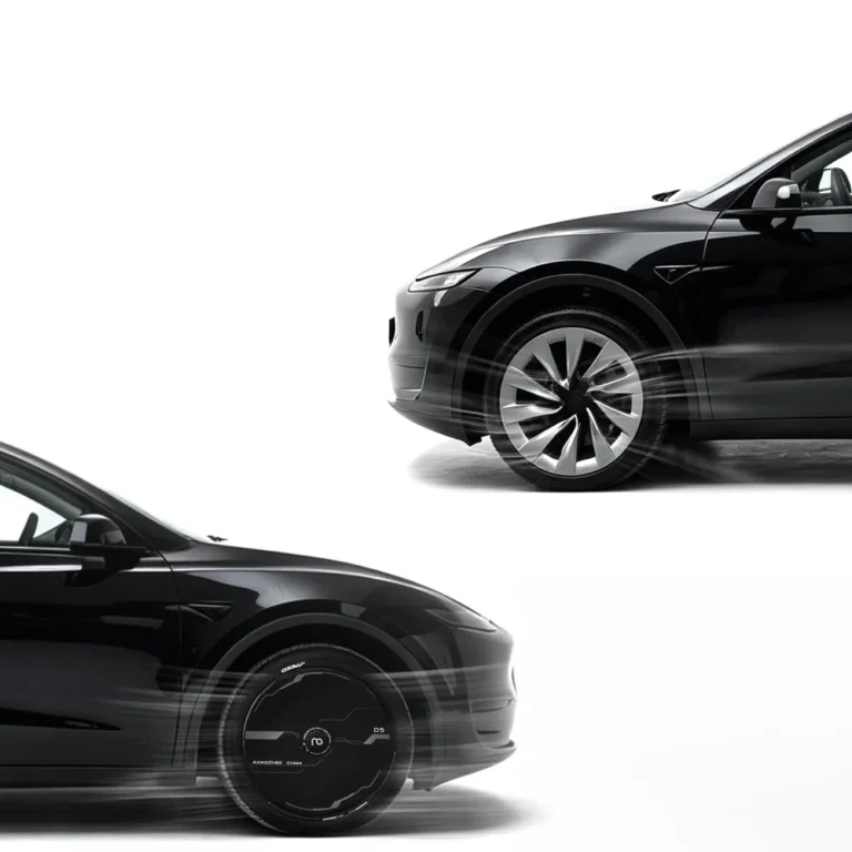 Black Tesla with smooth cyber wheel covers in motion