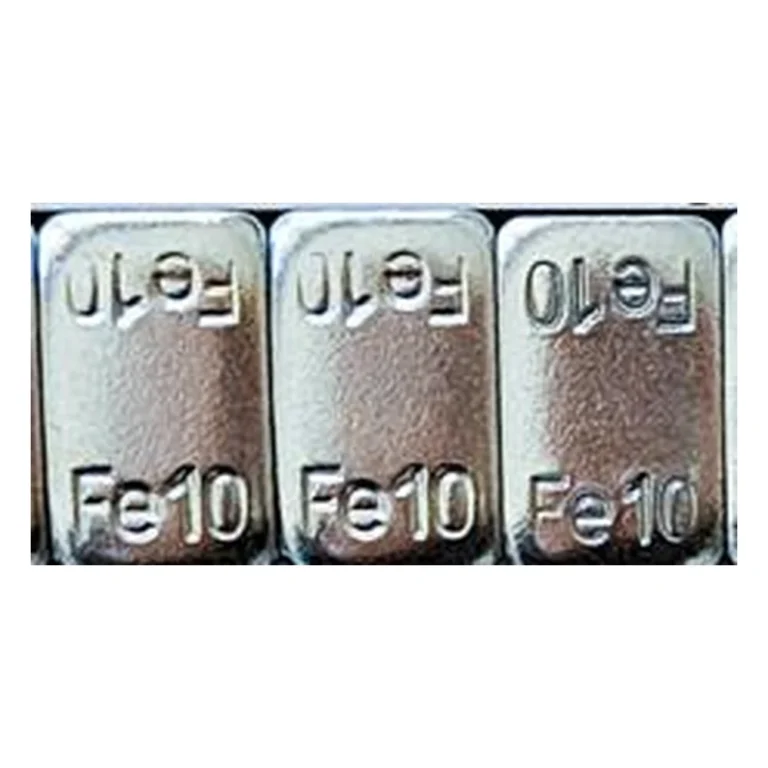Close-up of zinc plated thick Fe10 steel adhesive wheel weight segments