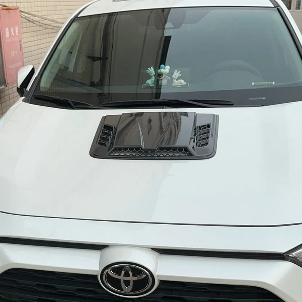 Best 11 Easy Exterior Car Mods for Detailing & Tuning Shops 3 Gloss black hood vent scoop installed on a white SUV bonnet