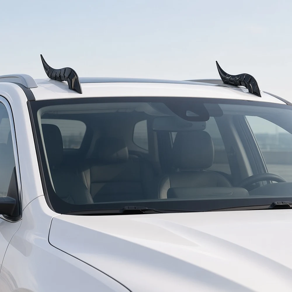 Universal Car Roof Dragon Horn Decoration, ABS, 6 Finishes 9 Pair of gloss black dragon horn decorations mounted on the front edge of a white SUV roof, front view