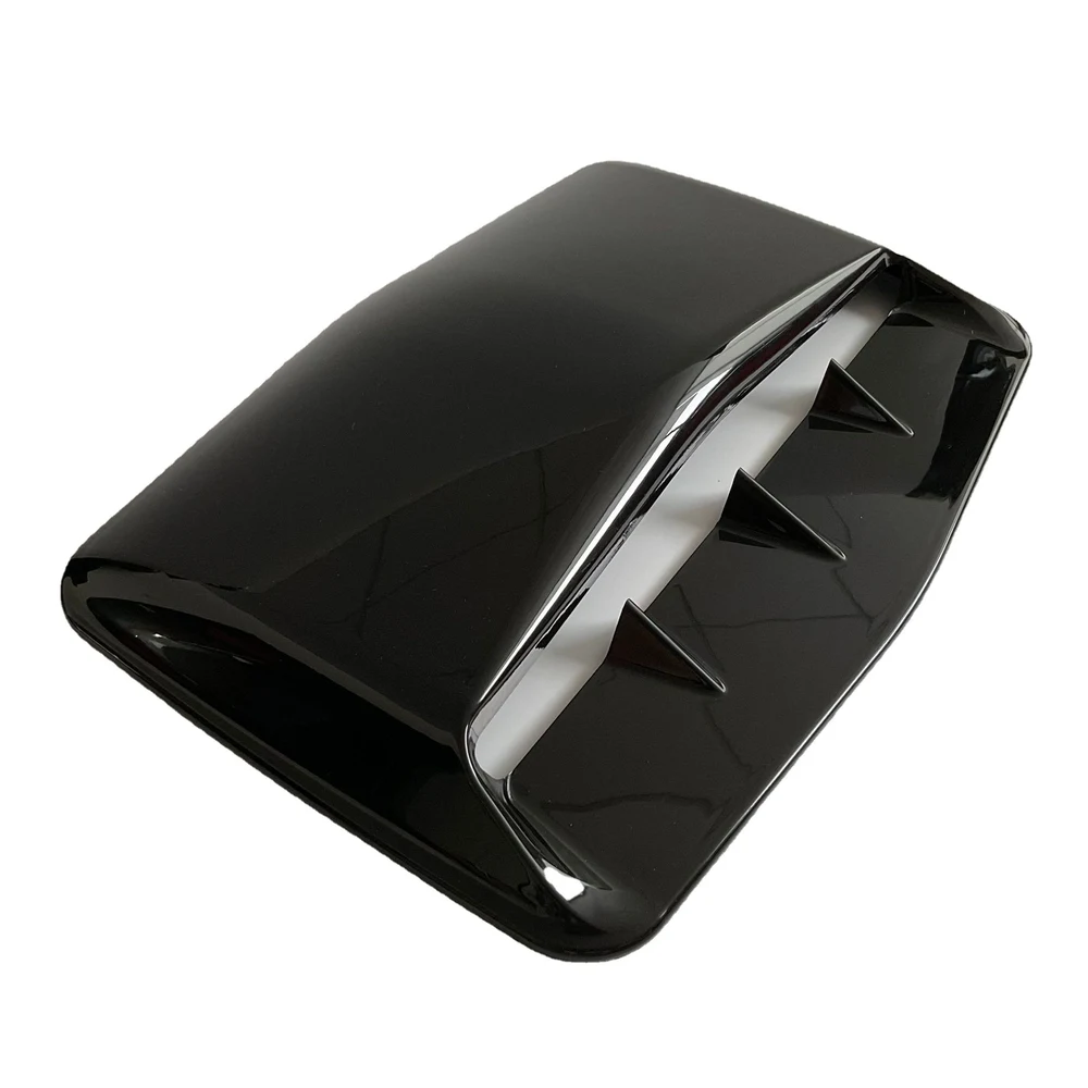 Gloss black hood scoop, angled view of shark-fin louvers