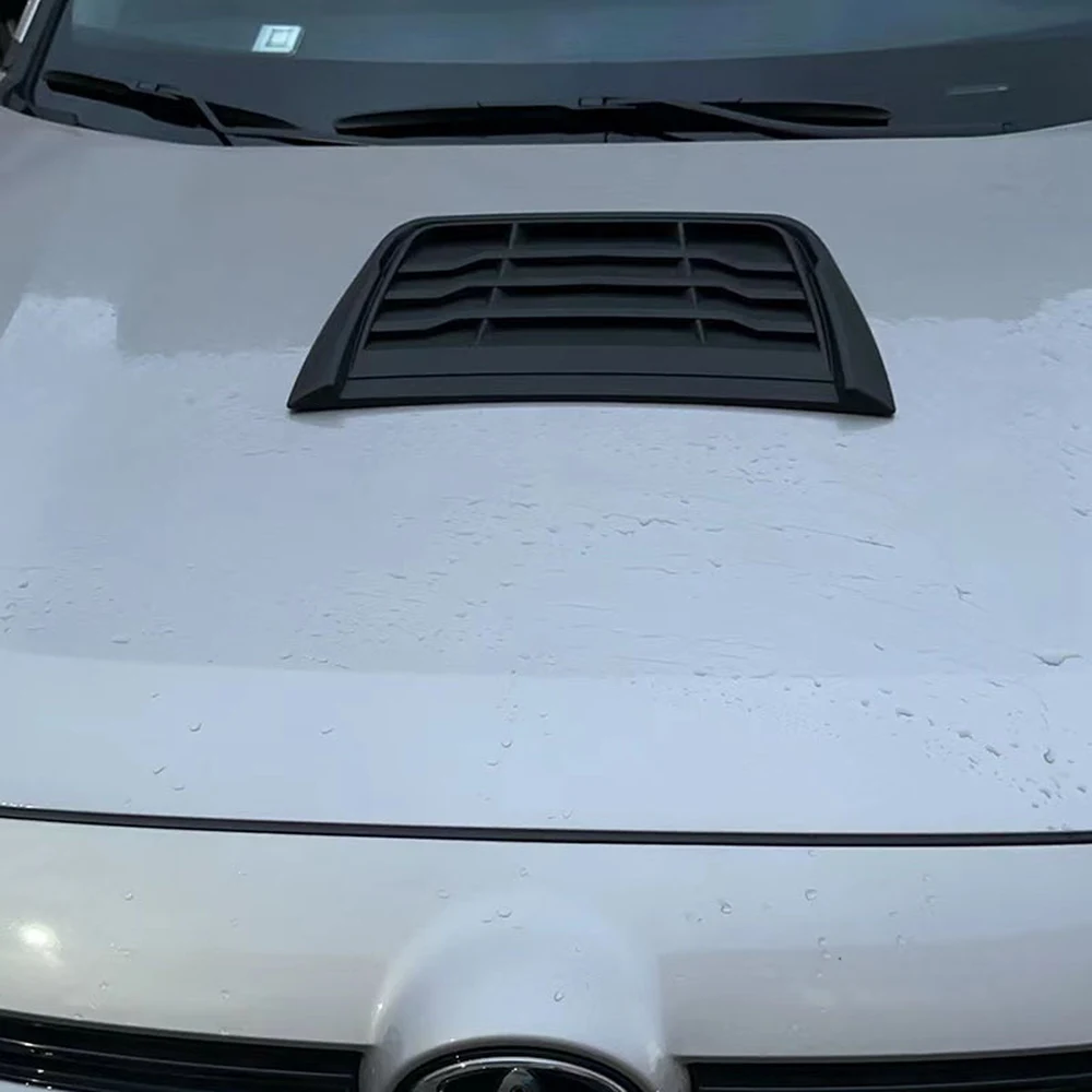 Best 11 Easy Exterior Car Mods for Detailing & Tuning Shops 4 Matte black louvered hood vent installed on a white car bonnet
