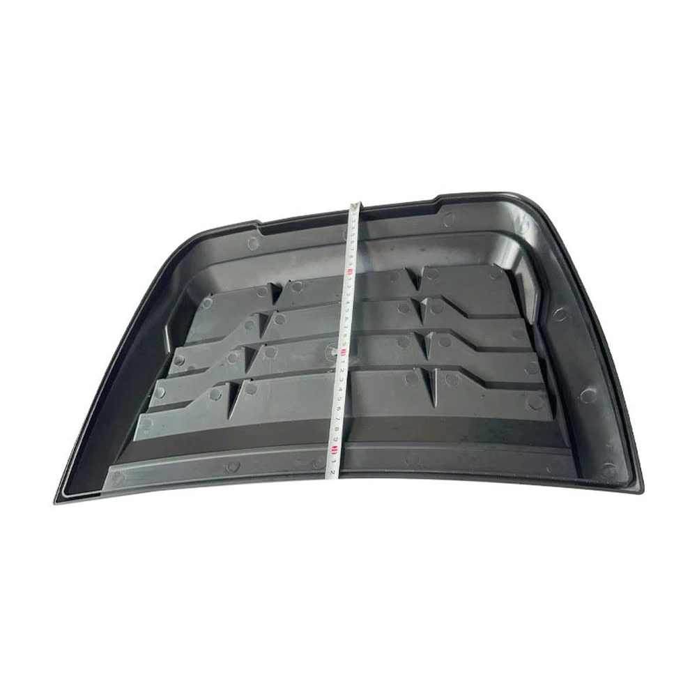 Hood vent measured across its width with a tape measure