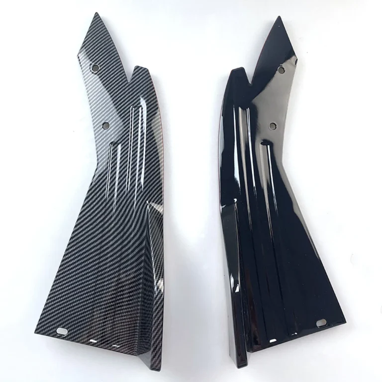Universal rear bumper corner guards in carbon-fibre pattern and gloss black on white background