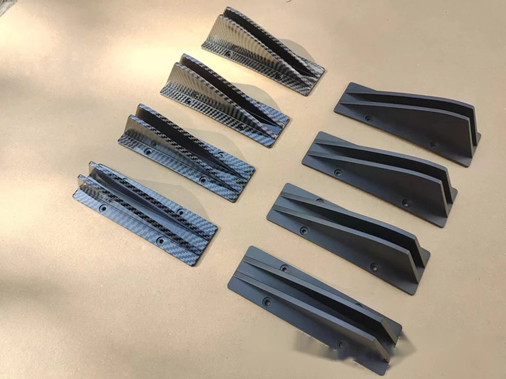 Four-piece shark fin sets in carbon fibre pattern and matte black
