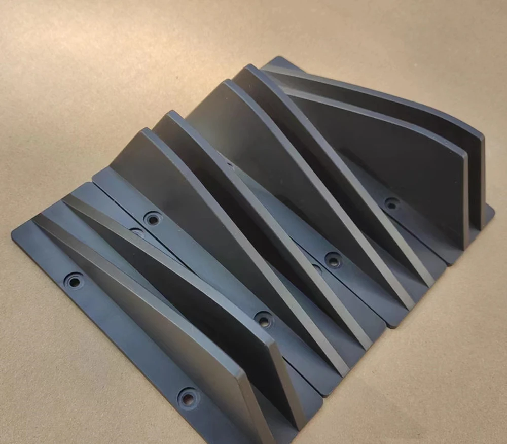 Underside of the shark fins showing pre-drilled mounting holes