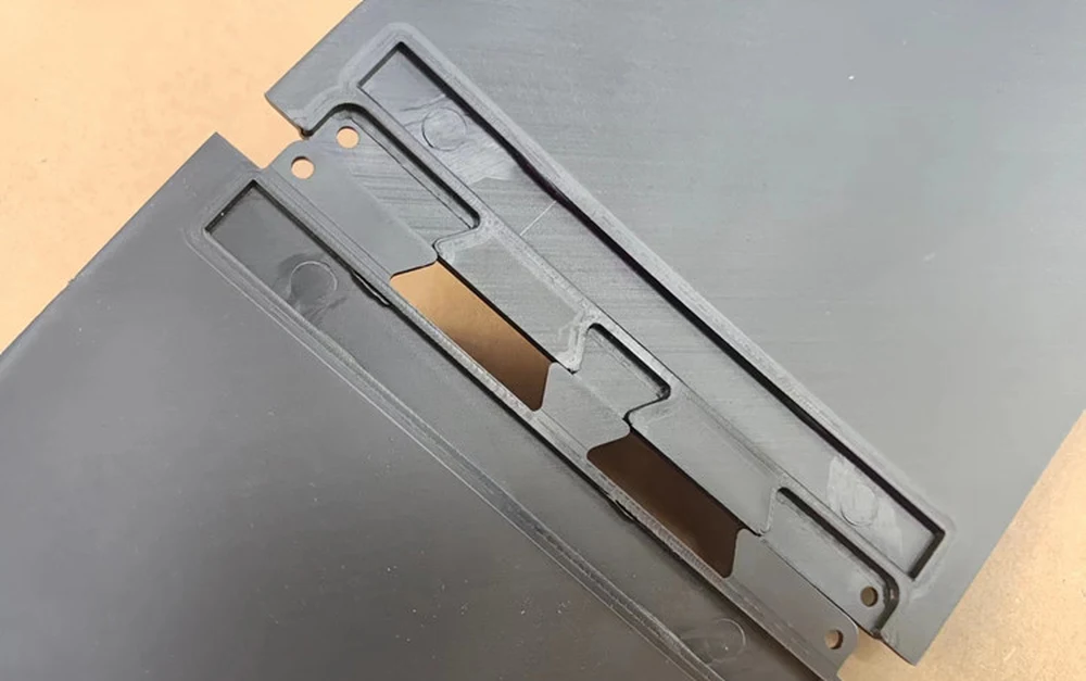 Joint section of the two-piece diffuser where the halves are screwed together