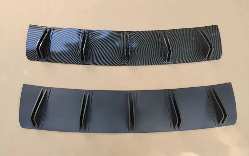 Two-piece shark fin diffusers in carbon fibre pattern and matte black