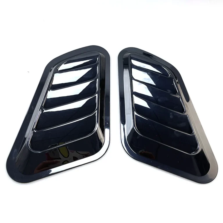 Pair of gloss black universal shark gill side vents on white background